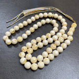 مسبحة مصنوعة يدوياً من الكهرمان الأبيض | 10.8 مم | 47 غ | 66 حبة