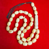 WHITE EGG SHAPE NATURAL AMBER MISBAHA 15.5mm x 21mm 129.7g