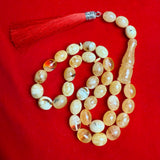 مسبحة إسلامية يدوية الصنع من الكهرمان، مقاس 11 مم × 14 مم، وزن 43.9 غرام.