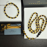 مصباحة من الكهرمان الأسود والماس، مقاس 8.5 × 12.5 مم، وزن 29.9 غرام، مع سوار هدية.