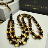 مصباحة من الكهرمان الأسود والماس، مقاس 8.5 × 12.5 مم، وزن 29.9 غرام، مع سوار هدية.