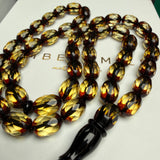 مصباحة من الكهرمان الأسود والماس، مقاس 8.5 × 12.5 مم، وزن 29.9 غرام، مع سوار هدية.