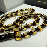 مصباحة من الكهرمان الأسود والماس، مقاس 8.5 × 12.5 مم، وزن 29.9 غرام، مع سوار هدية.