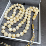 مسبحة مصنوعة يدوياً من الكهرمان الأبيض | 10.8 مم | 47 غ | 66 حبة