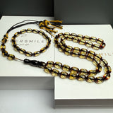 مصباحة من الكهرمان الأسود والماس، مقاس 8.5 × 12.5 مم، وزن 29.9 غرام، مع سوار هدية.