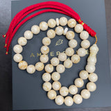 مسبحة من الكهرمان الأبيض مصنوعة يدوياً | 11.6 مم | 43 غ | 45 حبة