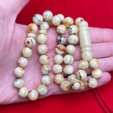 مسبحة صلاة إسلامية طبيعية من أوريو، مصنوعة من العنبر الأبيض، قطرها 10.7 مم ووزنها 32.7 غرام.