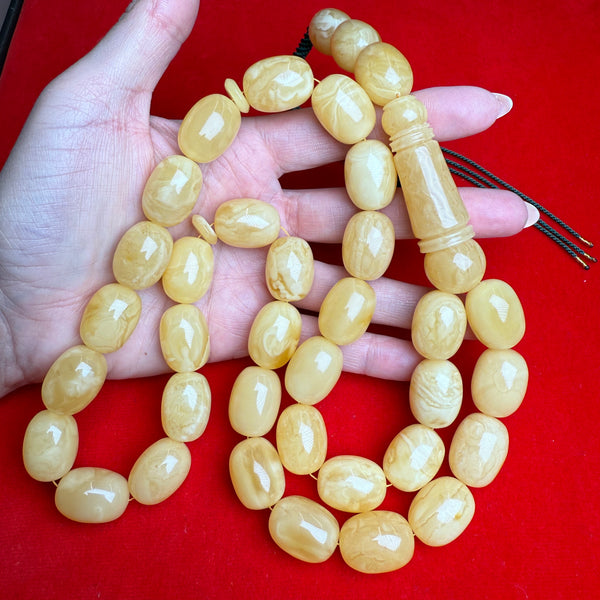 *YELLOW WHITE EGG SHAPE AMBER MISBAHA 16mm x 21mm 133G