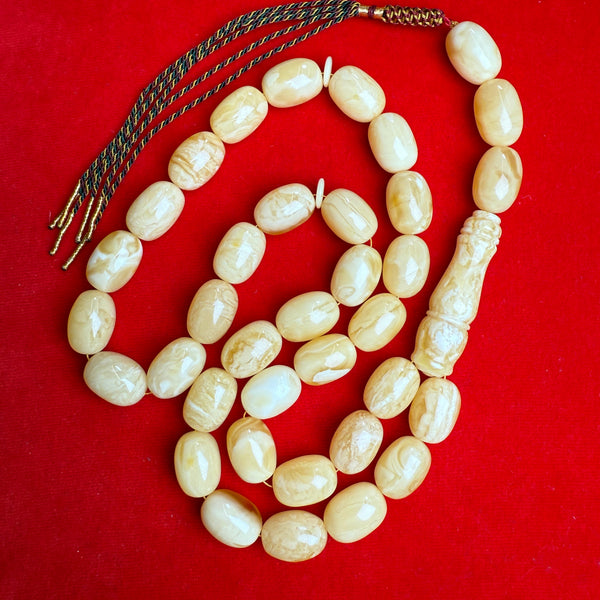 *WHITE EGG SHAPE AMBER MISBAHA 14.5mm x 20mm 107g