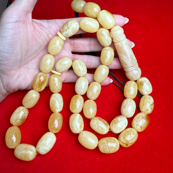 *YELLOW WHITE EGG SHAPE AMBER MISBAHA 16mm x 23mm 149G