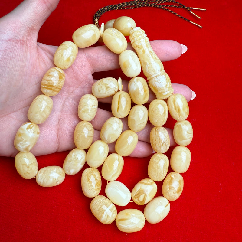*WHITE EGG SHAPE AMBER MISBAHA 14.5mm x 20mm 107g
