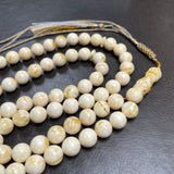 مسبحة مصنوعة يدوياً من الكهرمان الأبيض | 10.8 مم | 47 غ | 66 حبة