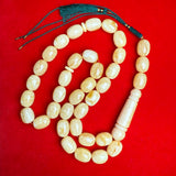 *WHITE EGG SHAPE AMBER MISBAHA 15mm x 20mm 124g