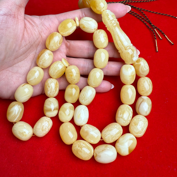 *WHITE EGG SHAPE AMBER MISBAHA 15mm x 19mm 111g