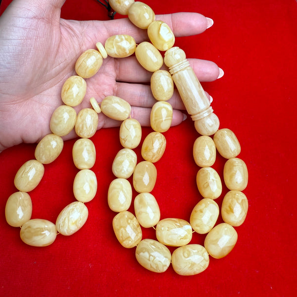 *WHITE EGG SHAPE AMBER MISBAHA 15.5mm x 21mm 129.7g