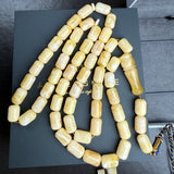 مسبحة كهرمان أبيض ملكي 51 خرزة 10 × 14 ملم 68.72 جرام شهادة مخبرية