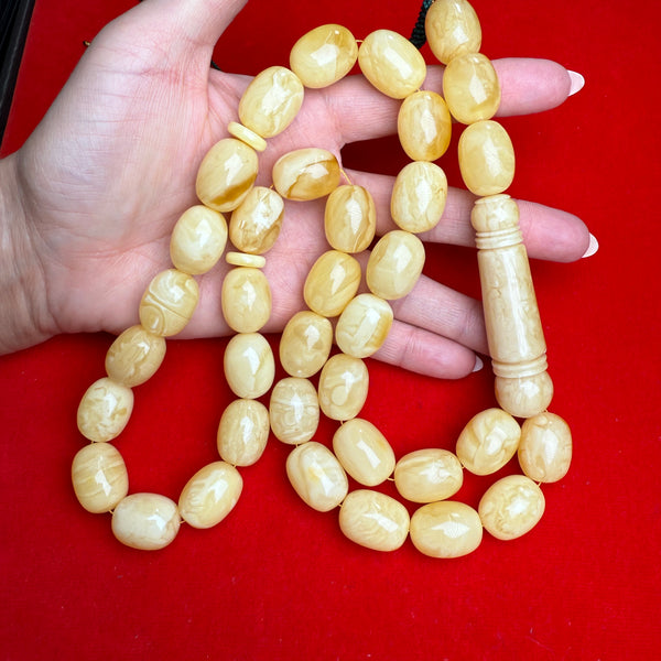 *WHITE EGG SHAPE AMBER MISBAHA 15mm x 20mm 124g