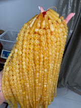 YELLOW TRANSPARENT AMBER MISBAHA 10-12mm